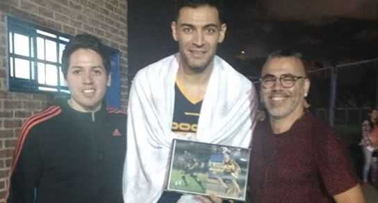 Carlos Delfino con Román Riquelme