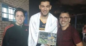 Carlos Delfino con Román Riquelme